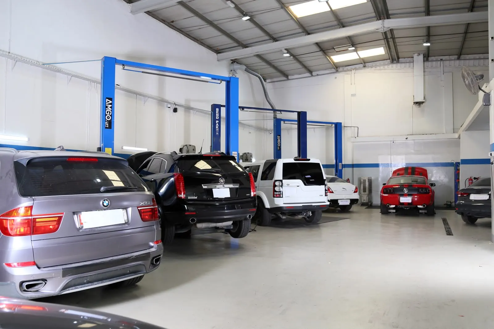 Engine repair technicians working inside the Missak workshop